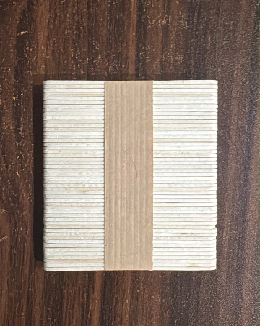 A banded bundle of Albizco wooden ice cream sticks